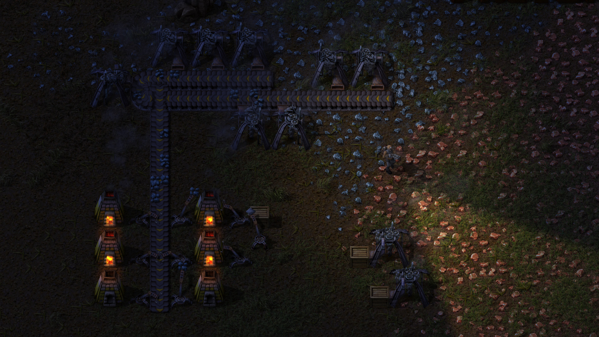 Burner miners and furnaces at night in Factorio — early-game mining on a Factorio server